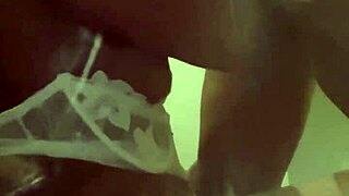 Sucking shoe plugg in front of the fridge.