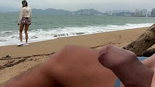 On the beach, I flash my huge cock and see you jerking off, feeling excited to help you cum in my mouth.