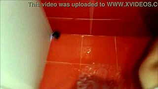 Under the shower, natural breasts get a refreshing bath