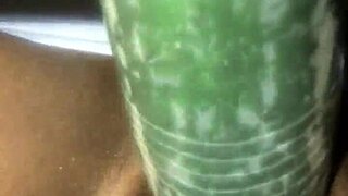 kissesxxx plays with cucumber outdoors