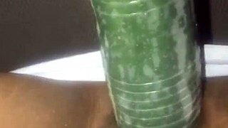 kissesxxx plays with cucumber outdoors