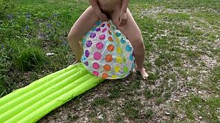 Hairy pussy milf indulges in outdoor beach fetish with inflatable toys