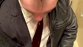 Kinky office suit in leather for men at play.