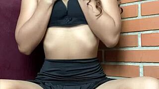 Petite girl plays solo with her black dildo