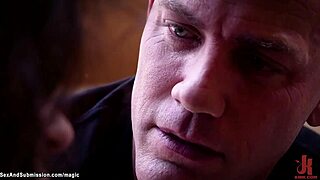 Whipping butt-plugged slaves in dark dungeon