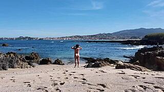 I spot curvy nudist flashing hairy pussy beachside