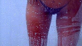 Gorgeous tanned college girl showers curves in skimpy bikini!