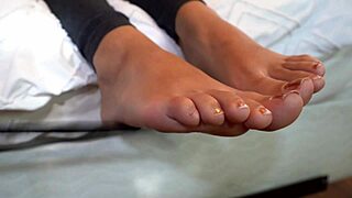 Her heels tease with giggles and seductive foot struts