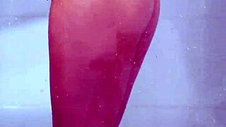 Gorgeous tanned college girl showers curves in skimpy bikini!