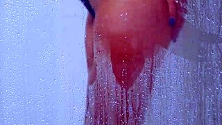 Gorgeous tanned college girl showers curves in skimpy bikini!