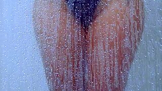 Gorgeous tanned college girl showers curves in skimpy bikini!