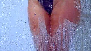 Gorgeous tanned college girl showers curves in skimpy bikini!