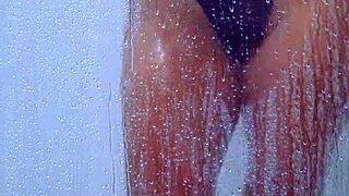 Gorgeous tanned college girl showers curves in skimpy bikini!