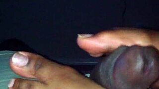 Damn ebony babe strokes black cock perfectly with her soft feet!