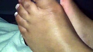 Damn ebony babe strokes black cock perfectly with her soft feet!