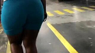 Thick ebony booty jiggles in spandex leggings candid walk hidden spy cam catches natural tits bounce