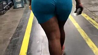 Thick ebony booty jiggles in spandex leggings candid walk hidden spy cam catches natural tits bounce