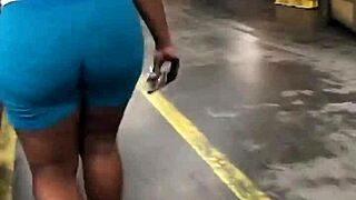 Thick ebony booty jiggles in spandex leggings candid walk hidden spy cam catches natural tits bounce