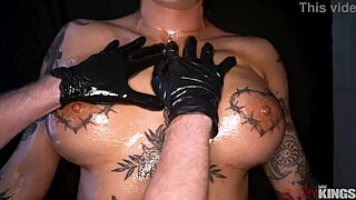 Tattooed brunette oiled up for deep anal massage pounding