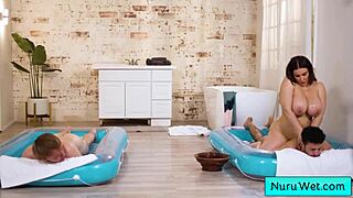 natasha nice's huge tits bounce as she fucks two young studs in nuru massage threesome