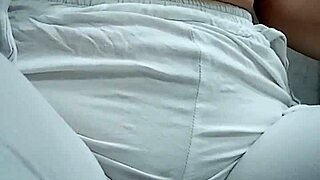 check her out squatting low while making a steamy puddle on the floor