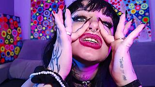 Submissive chubby goth Deedee Love spits on pierced tits and begs for cum