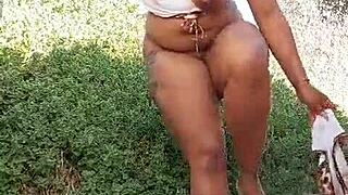 She fingers her big pussy outdoors until squirting wildly everywhere