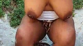 She fingers her big pussy outdoors until squirting wildly everywhere