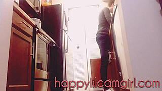 giantess girl cleans kitchen while ignoring your tiny gaze on webcam