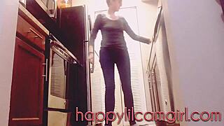 giantess girl cleans kitchen while ignoring your tiny gaze on webcam