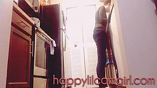 giantess girl cleans kitchen while ignoring your tiny gaze on webcam