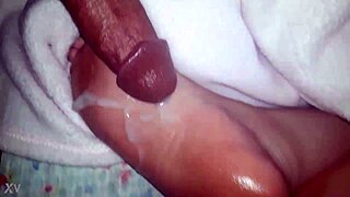 thick cumshot blasts across her slick oiled feet