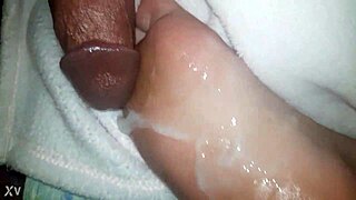 thick cumshot blasts across her slick oiled feet