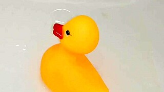 Blonde Milf Fingers Pussy with Rubber Duck in Bathroom