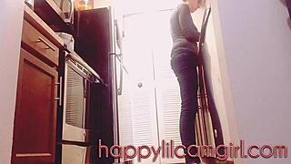 giantess girl cleans kitchen while ignoring your tiny gaze on webcam