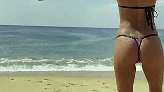 monika fox flaunts her pink bikini stars on the beach posing sexy