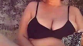check out this mature blonde with huge natural tits and big pussy lips flashing on the beach