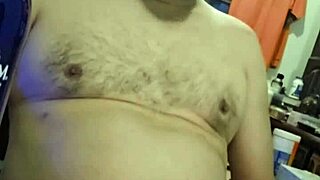 Curvy Ezsosa flashes fat tits and cock in wild bedroom exhibition