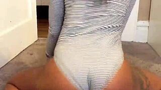 unsnap to reveal her tempting natural tits and tattooed curves