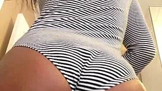 unsnap to reveal her tempting natural tits and tattooed curves