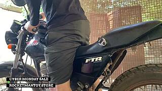 guy straps rocketman toy to his bike and shakes from the ride