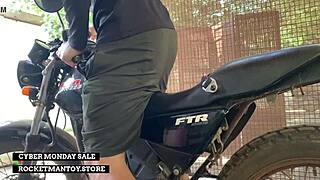 guy straps rocketman toy to his bike and shakes from the ride