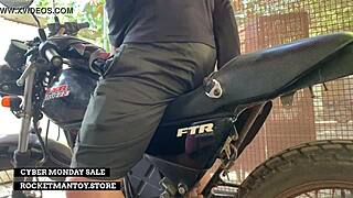 guy straps rocketman toy to his bike and shakes from the ride