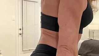 A muscular housewife flexes her powerful body for all the devoted fans who crave that intense display