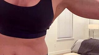 A muscular housewife flexes her powerful body for all the devoted fans who crave that intense display