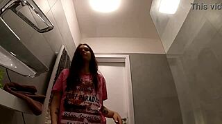 Redhead rips t-shirt in bathroom to flash tight panty ass and pussy