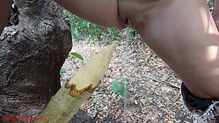 Perverted slut impales pussy on stake squirts piss forest