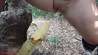 Perverted slut impales pussy on stake squirts piss forest