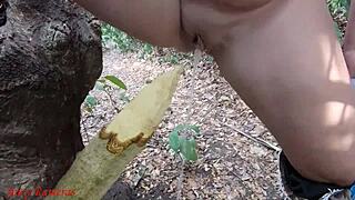 Perverted slut impales pussy on stake squirts piss forest