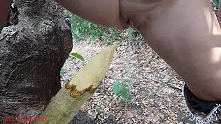 Perverted slut impales pussy on stake squirts piss forest